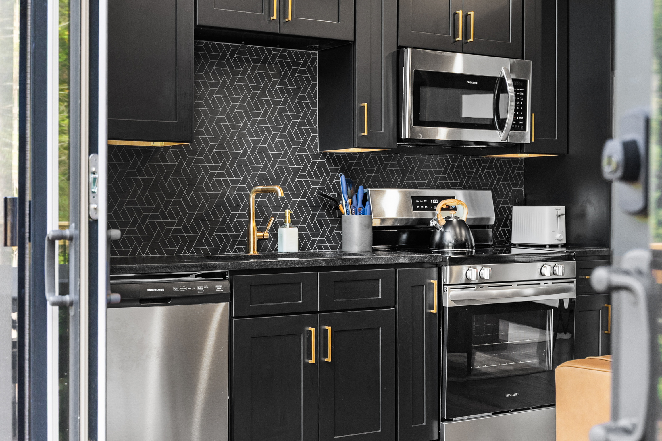 Detail of high-end kitchen appliances, custom chosen and integrated into a custom-built Contemporary Luxury Mountain Home Cabin in the Smoky Mountain, Gatlinburg, Pigeon Forge, Sevierville region.