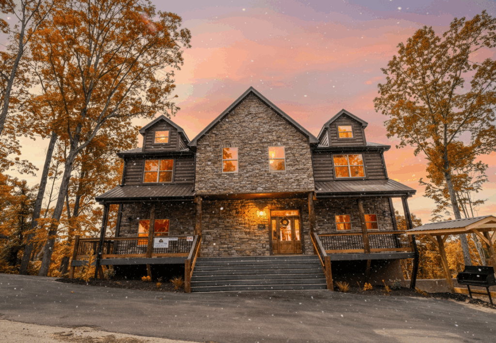 Front exterior of a beautiful luxury mountain cabin home, emanating warmth, fully lit and decorated, ready to welcome family for Thanksgiving gatherings in the Smoky Mountains.