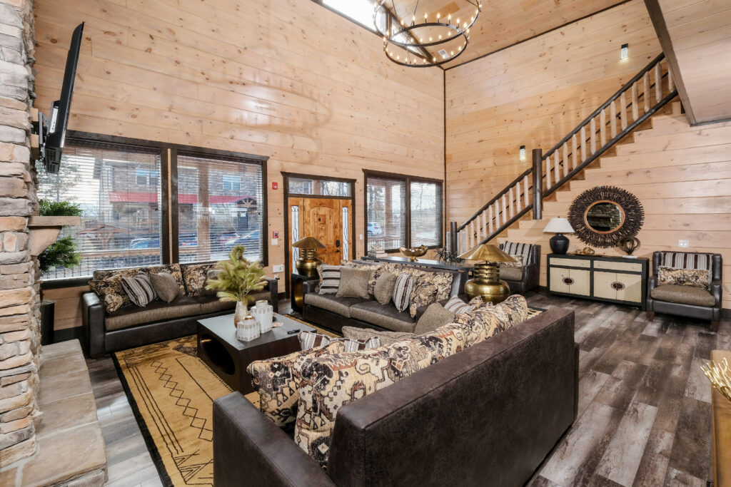High-ceiling luxury mountain home interior featuring an open-concept living room and grand entrance. Viewed from above to showcase the spacious custom design by MCHB in the Smoky Mountains.
