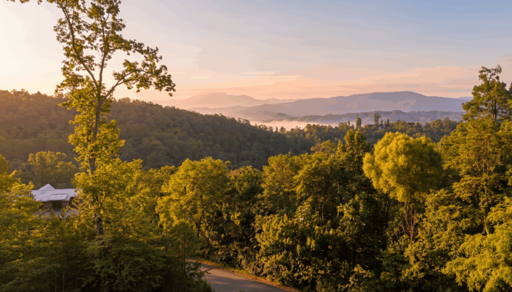 Lush landscape of the Smoky Mountains near Gatlinburg and Sevierville, TN. A scenic view of rolling mountain ridges and dense forest, where MCHB builds custom luxury mountain homes.