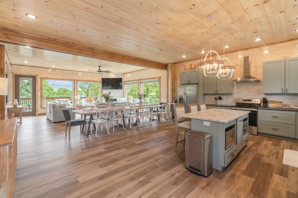 Interior open-concept living room of Shell Mountain Sunrise cabin. Designed by MCHB to comfortably accommodate large groups of up to 20 guests with modern-mountain finishes.