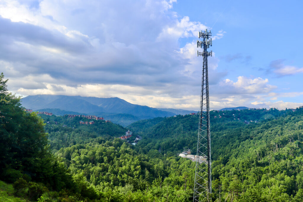 Panoramic view of lush green Smoky Mountain peaks under a cloudy Earth Day sky in Gatlinburg, TN.