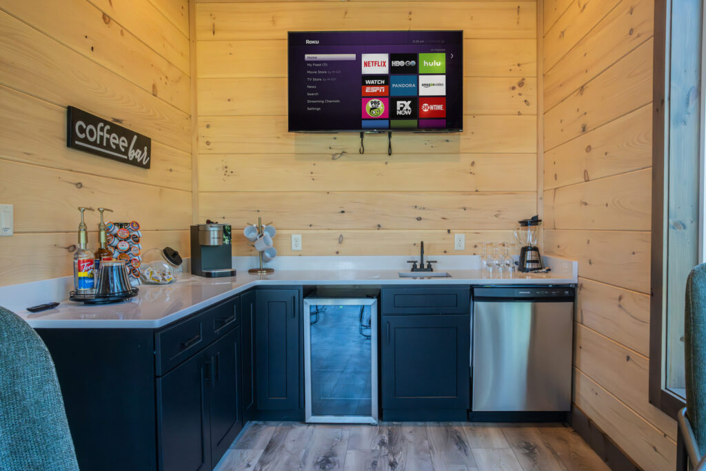 Modern coffee machine on a custom MCHB marble countertop in Gatlinburg, TN. Features high-end appliances, detailed marble veining, and luxury cabin kitchen finishes.