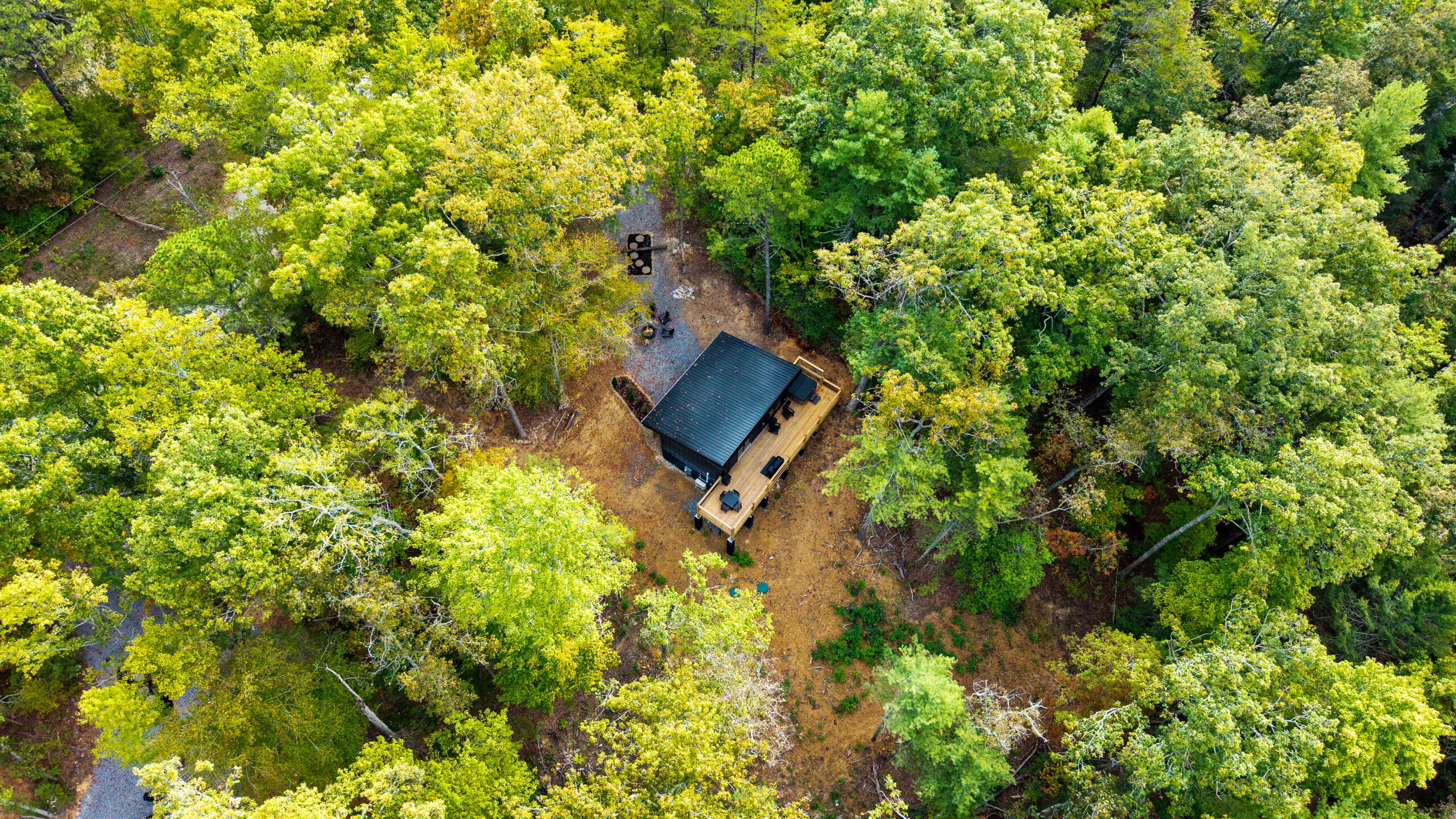 Luxury MCHB mountain home in East Tennessee, expertly integrated into the natural forest surroundings and lush landscape of the Smoky Mountains.