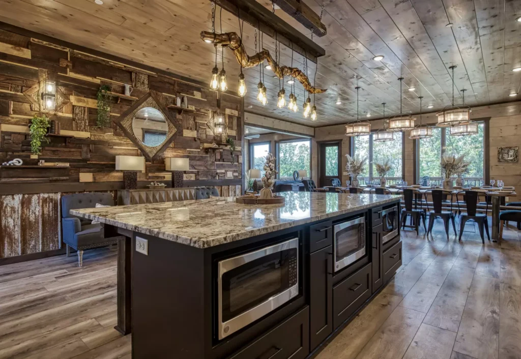 Wide-angle view of a modern marble breakfast bar and kitchen island in a Pigeon Forge custom mountain home.